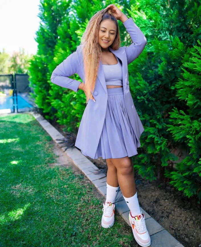 Light-purple relaxed blazer with pleated skirt set, side view