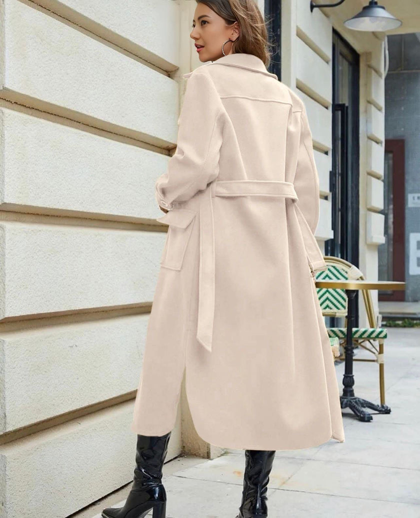 Knee-length belted trench coat in beige, buttoned front with flap pockets