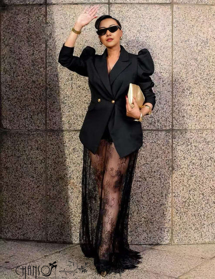 Black puff-sleeve blazer with gold buttons and black lace maxi skirt, front view