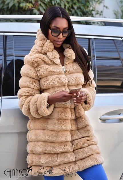 Nude hooded fur coat with full zip, thick shaggy texture and long sleeves