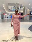 Light mauve long-sleeve peplum top with layered ruffles and pleated asymmetric maxi skirt