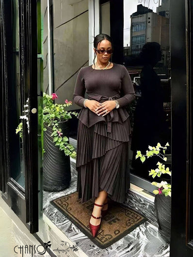 Mauve long-sleeve peplum top and pleated asymmetric maxi skirt two-piece set
