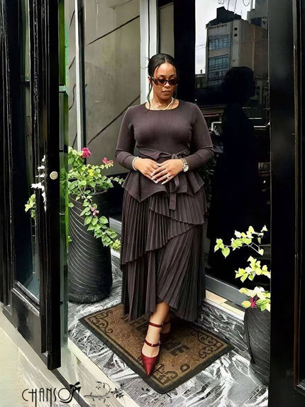 Mauve long-sleeve peplum top and pleated asymmetric maxi skirt two-piece set