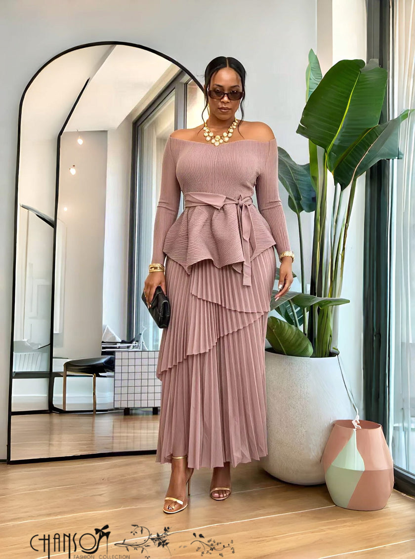 Blush pink long-sleeve peplum top with ruffled tiers and matching pleated maxi skirt set