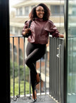 Cropped maroon leather jacket with stand collar and front zipper, relaxed oversized fit