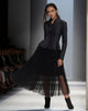 Black pleated midi skirt outfit with long-sleeve peplum jacket and button front