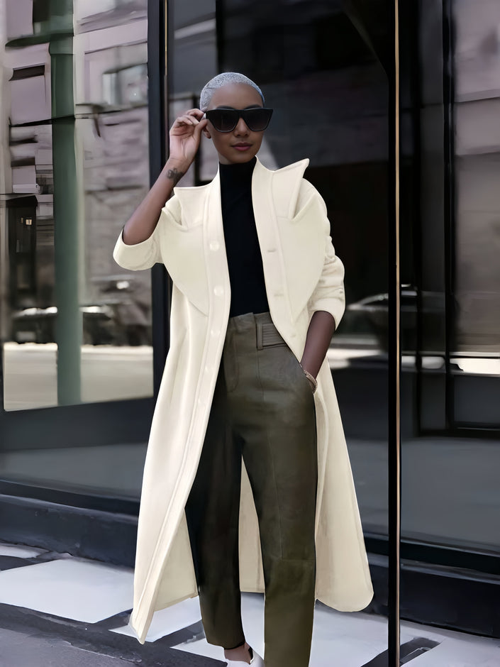 Cream long double-breasted coat with button front and notched lapels