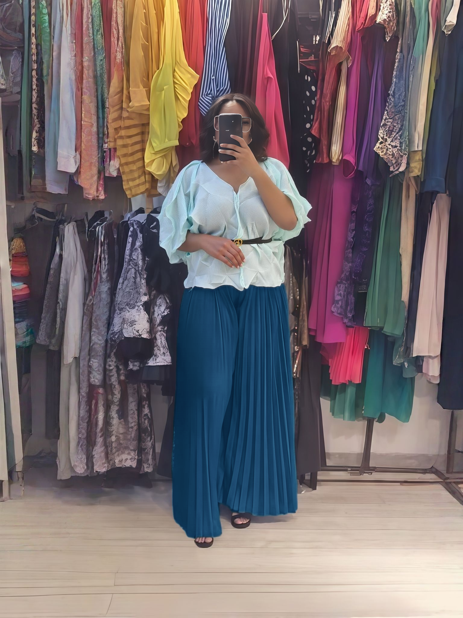 Light blue ruffle blouse and teal pleated wide-leg pants set
