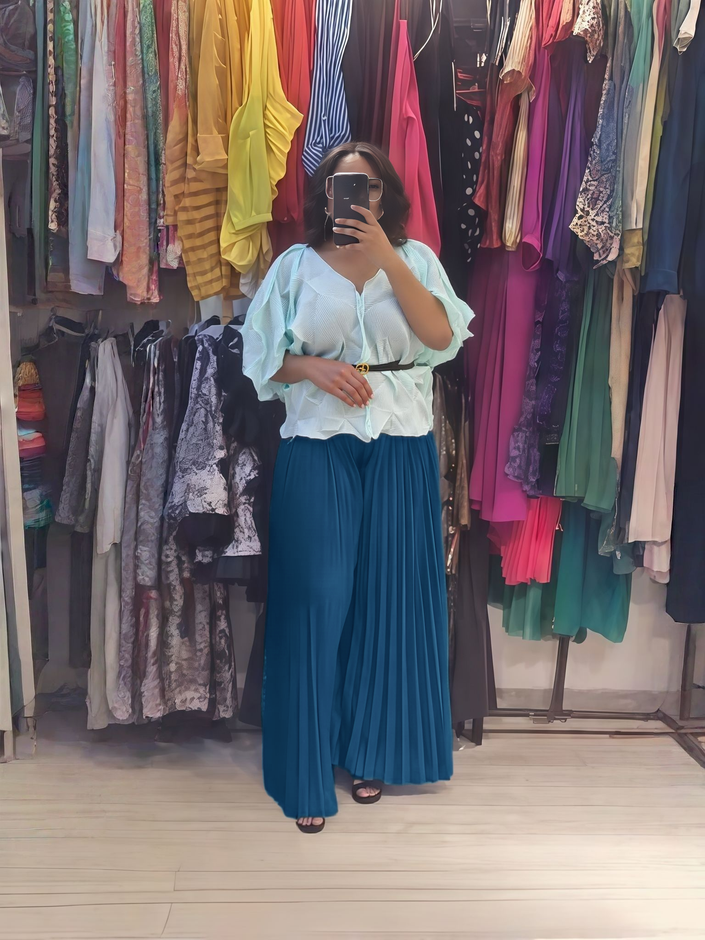 Light blue ruffle blouse and teal pleated wide-leg pants set