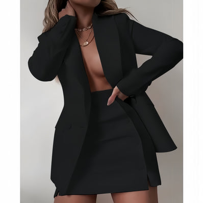 Black blazer dress set with notched lapels and matching mini skirt, buttoned front.