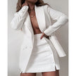 White blazer dress set with notched lapels and matching mini skirt, buttoned front.