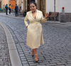 Khaki midi coat dress with gold button front, V-neck, and fitted waist