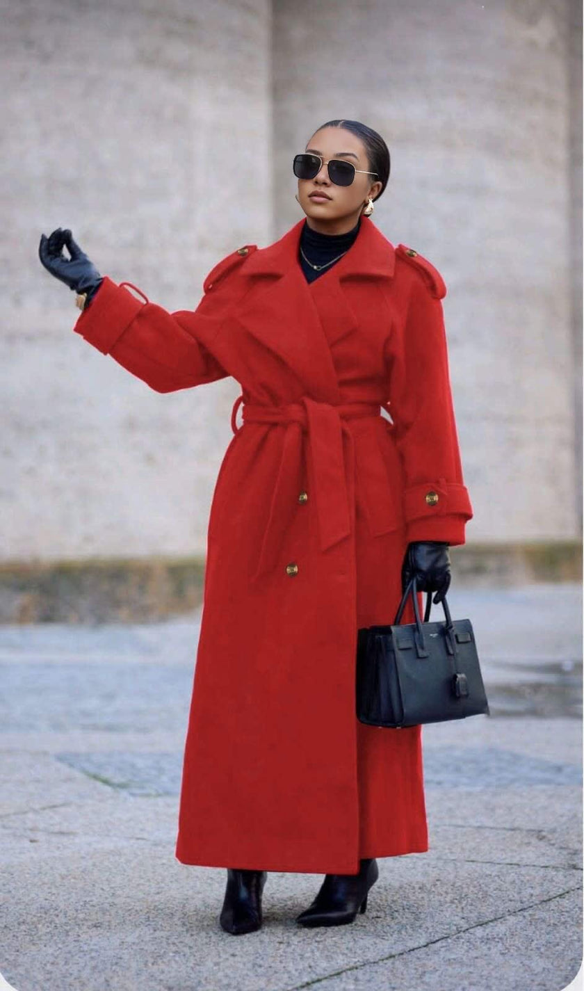 Red double-breasted belted coat with wide lapels and long sleeves, ankle length.