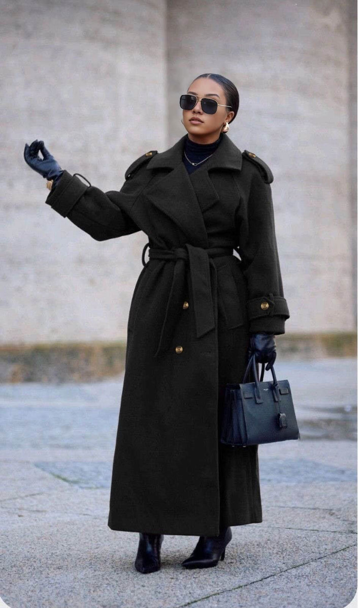 Black double-breasted belted coat with wide lapels and long sleeves, ankle length.