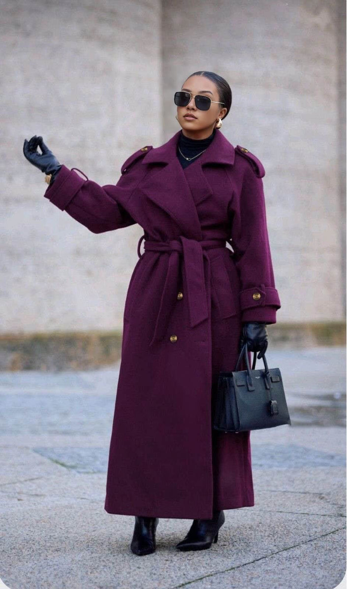 Maroon double-breasted belted coat with wide lapels and long sleeves, ankle length.