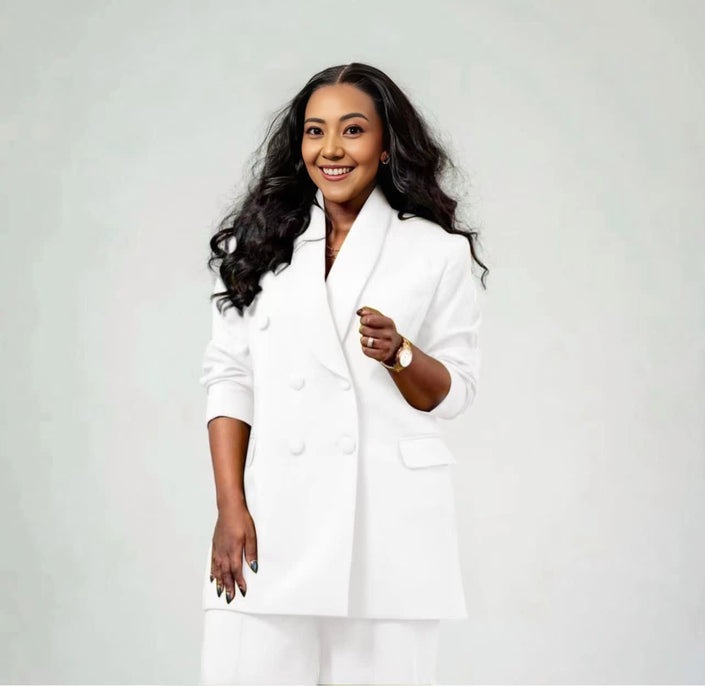 White twin set suit with double-breasted blazer and matching straight-leg trousers
