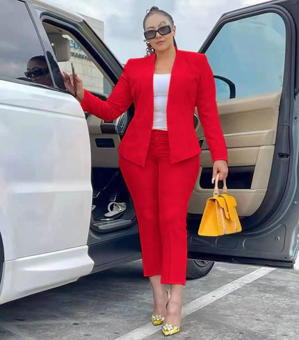 Red blazer and trouser set with tailored lapels and matching straight-leg pants