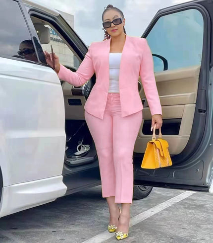 Pink blazer and trouser set with tailored lapels and matching straight-leg pants