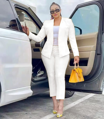 White blazer and trouser set with tailored lapels and matching straight-leg pants