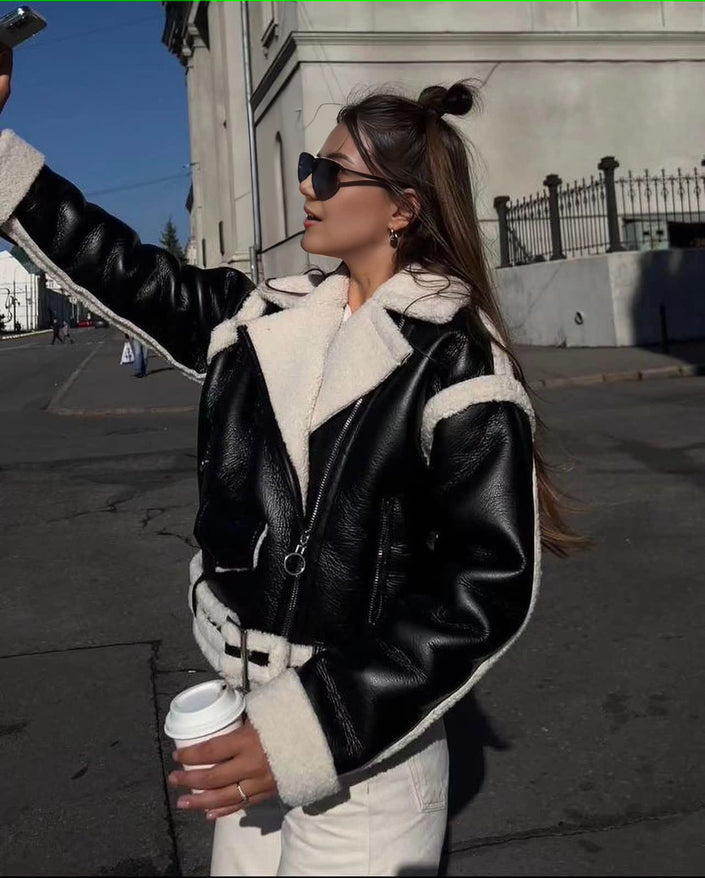 Black shearling biker jacket with zip front, white shearling collar and cuffs