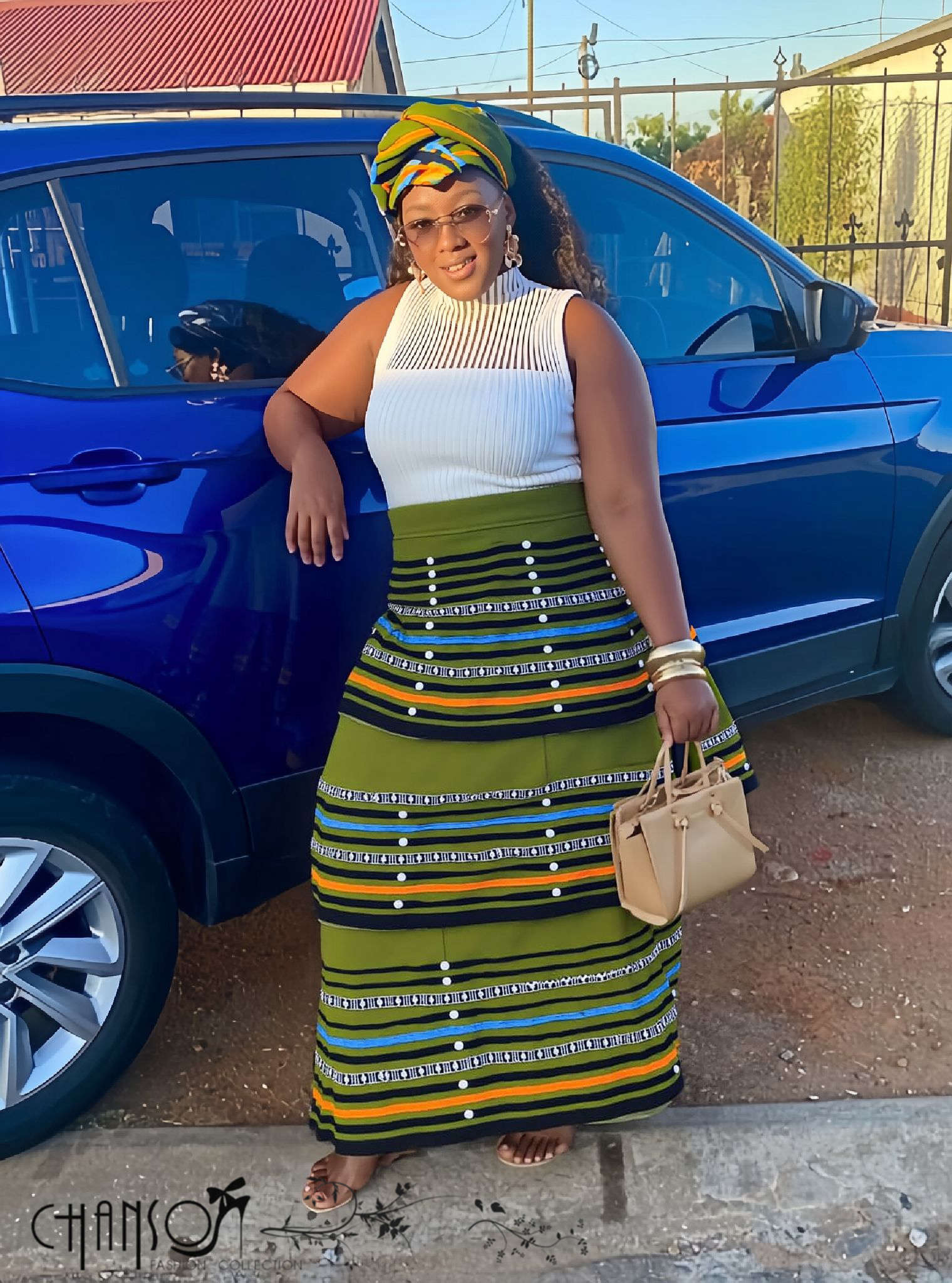 African maxi skirt set: white sleeveless top with green striped maxi skirt