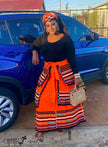 African maxi skirt set: black top with orange striped maxi skirt and tied waist sash