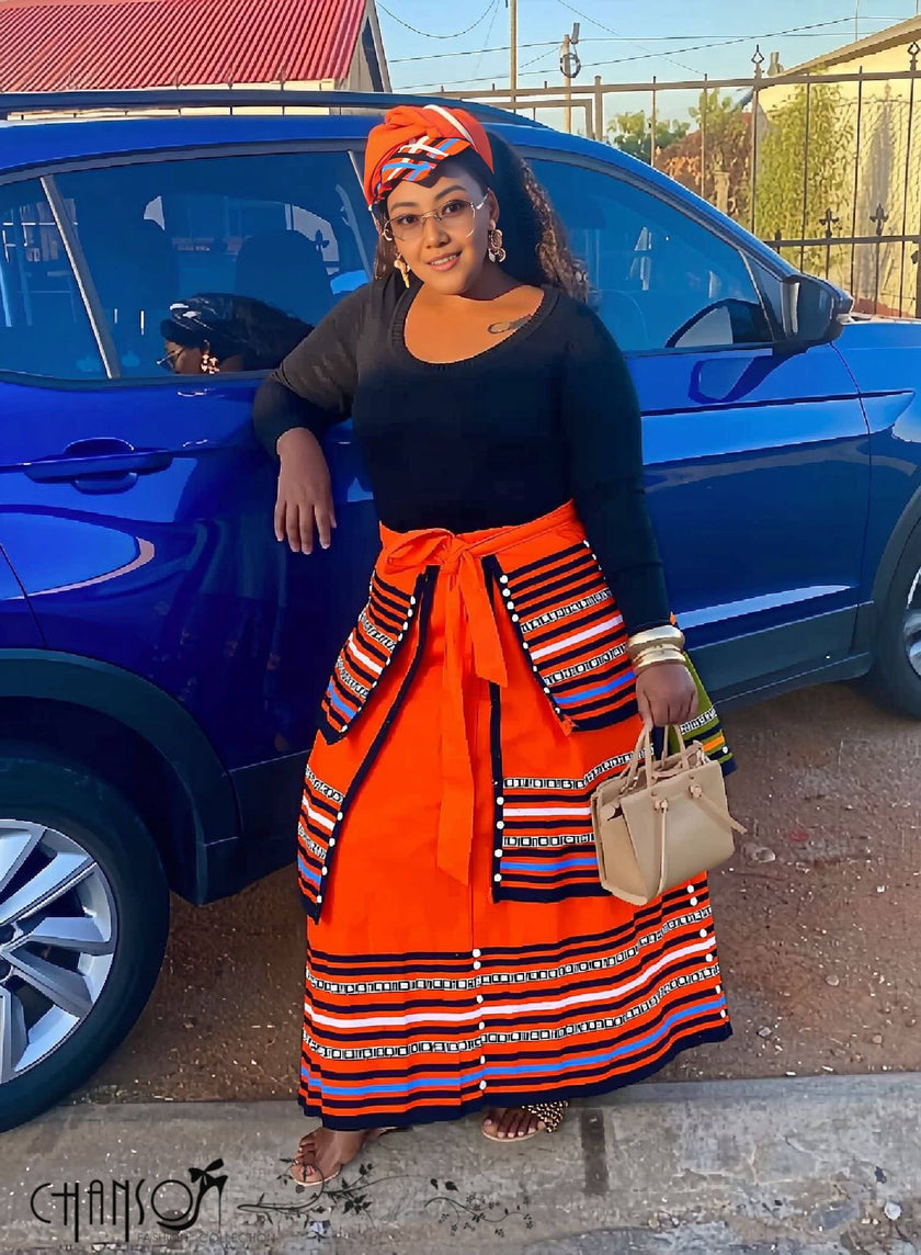 African maxi skirt set: black top with orange striped maxi skirt and tied waist sash