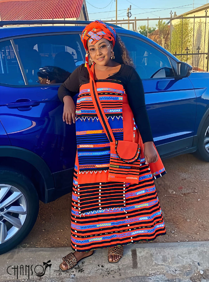 Geometric print maxi skirt set with orange headwrap, black top, long striped skirt