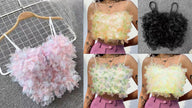 Layered petal crop top shown in pastel pink, pastel green, and black floral ruffles