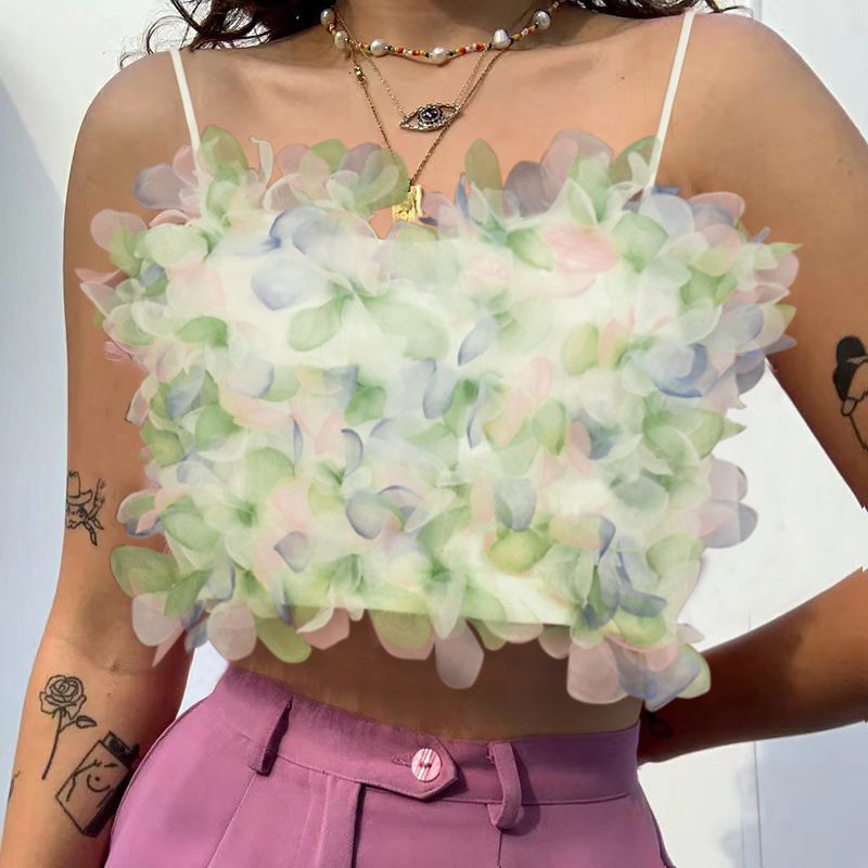 Layered petal crop top with spaghetti straps, pastel green and white floral ruffles