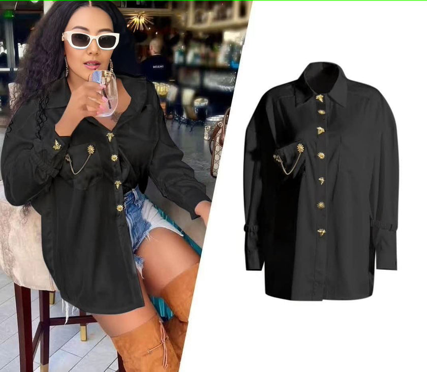 Black long-sleeve blouse with ruffle front, gold button placket and pintuck detail