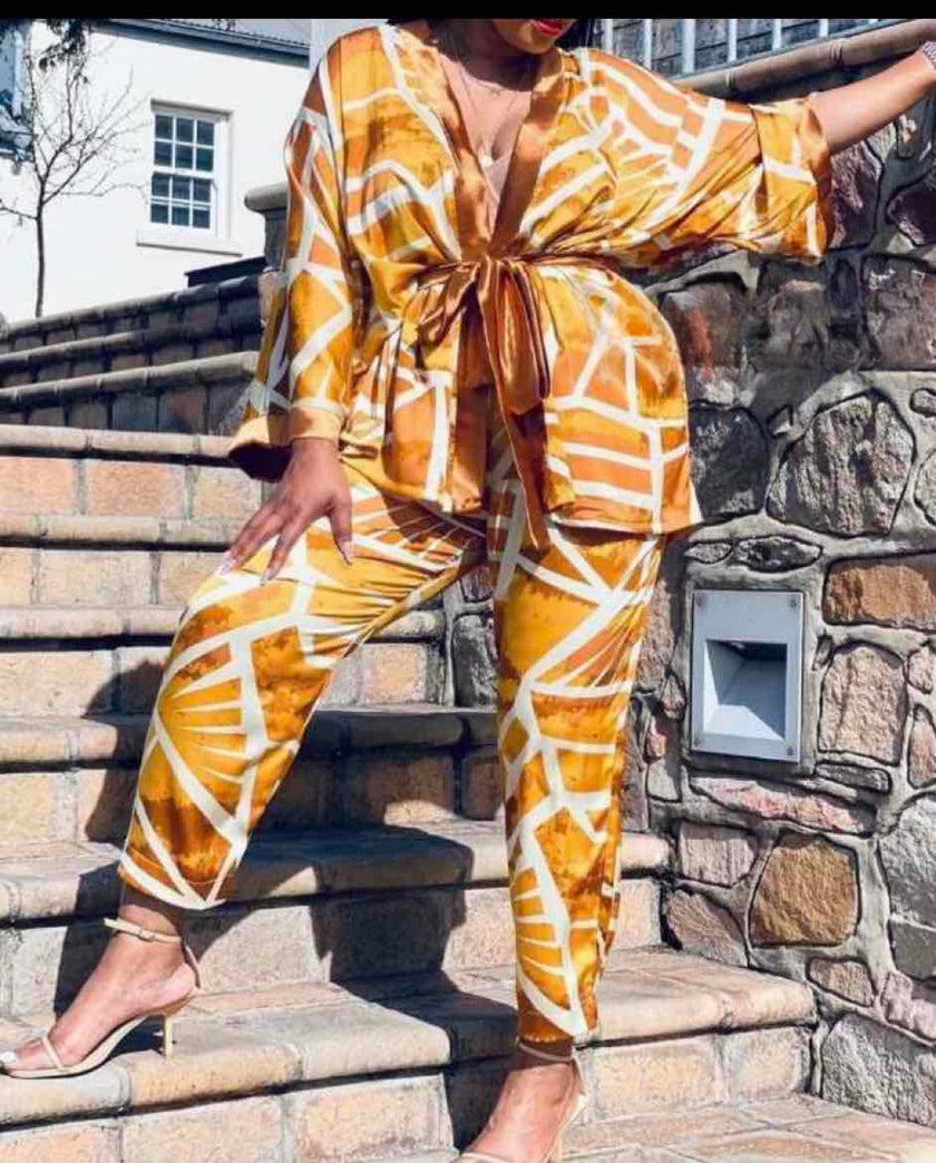 Printed blouse and tie-waist pants set, orange and white geometric pattern