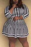 Geometric knit flare dress in black and white with long wide sleeves