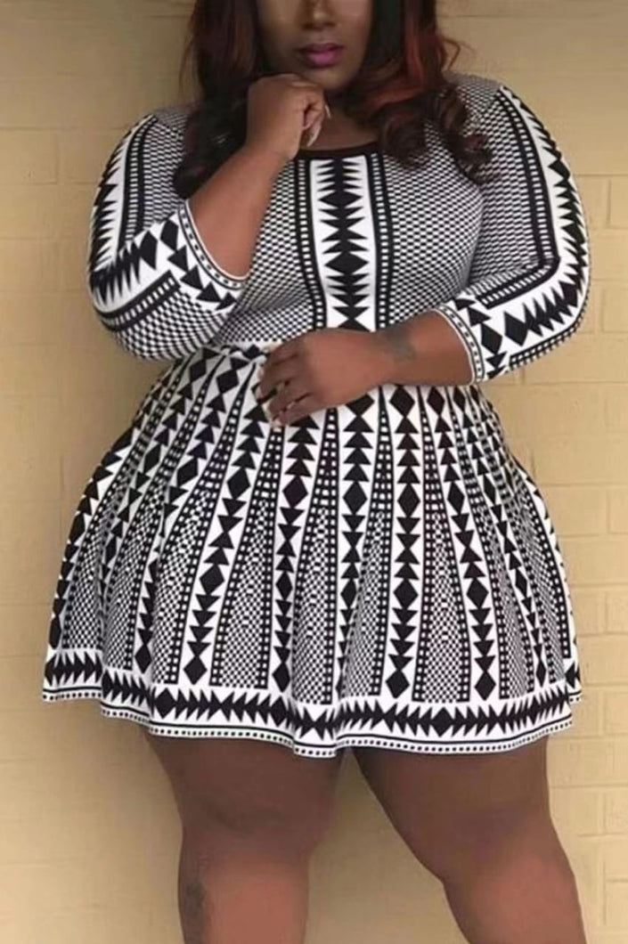 Geometric knit flare dress in black and white with long wide sleeves
