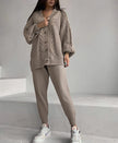 Tan knit cardigan over slim trousers set, cable stitch with button front