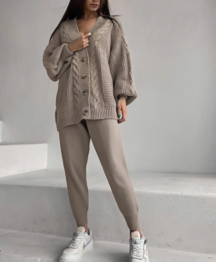 Tan knit cardigan over slim trousers set, cable stitch with button front