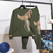 Dark-olive knit set with sequined bird motif sweatshirt and matching jogger pants