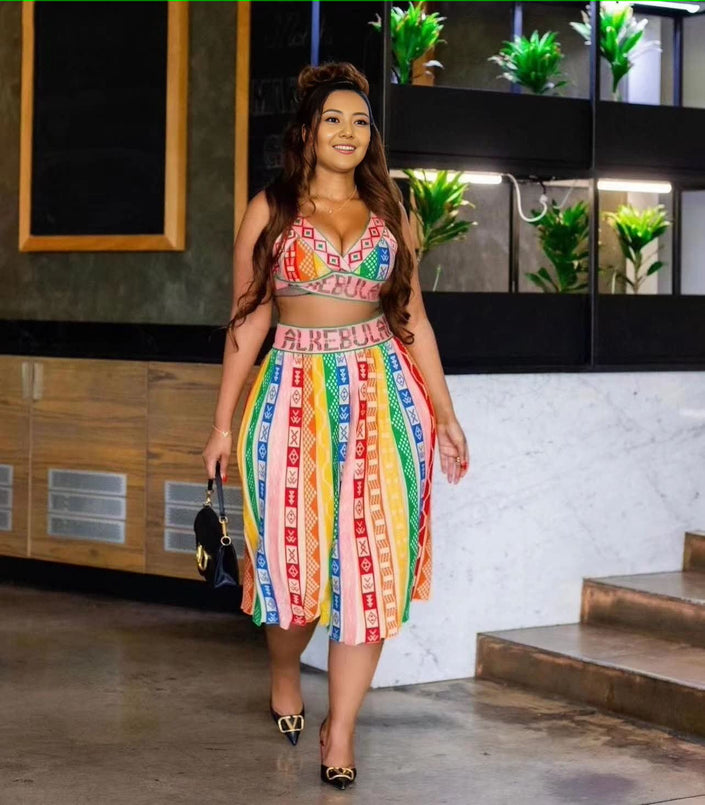 Geometric knit crop top and colorful midi skirt, sleeveless V-neck with vertical stripe print
