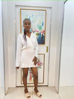 White long-sleeve shirt and ruffle-waist mini skirt set, front view