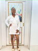 White long-sleeve shirt and ruffle-waist mini skirt set