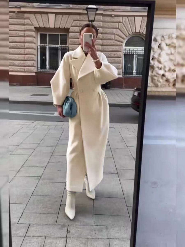 Beige oversized belted coat with wide lapels and long, straight silhouette