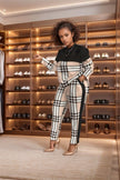 Black long-sleeve top with plaid pants twin set, high-waist fit.
