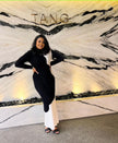 Dual-tone maxi dress with long sleeves, high neck; black top and white skirt