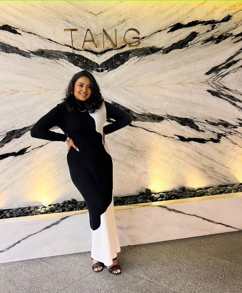 Dual-tone maxi dress with long sleeves, high neck; black top and white skirt