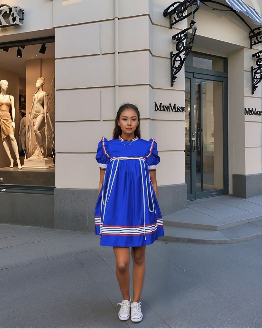Blue puff-sleeve dress with white striped details and red-trimmed hem