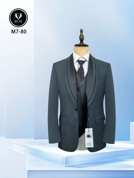 Dark green tuxedo suit with shawl lapel jacket, matching vest and necktie on mannequin