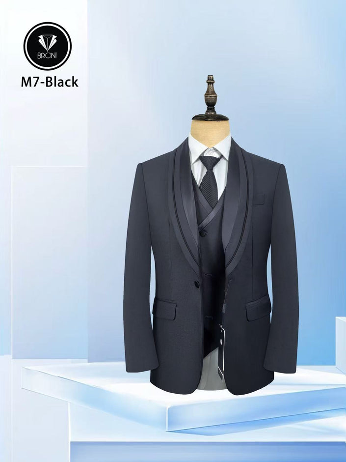 Dark men's tuxedo suit with satin shawl lapels, matching waistcoat and necktie