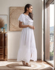 White sequin flutter sleeve maxi dress with cap sleeves and full gathered skirt slit hem