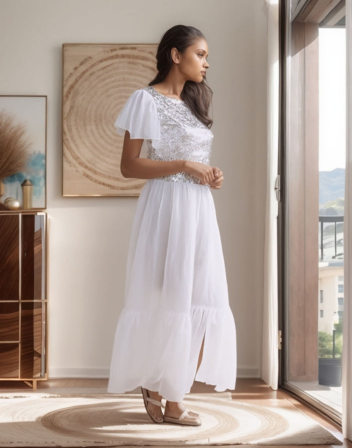 White sequin flutter sleeve maxi dress with cap sleeves and full gathered skirt slit hem