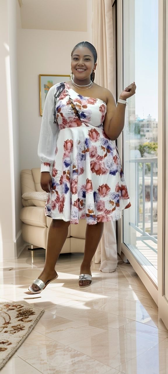One-shoulder floral puff-sleeve dress in white with multicolor blooms
